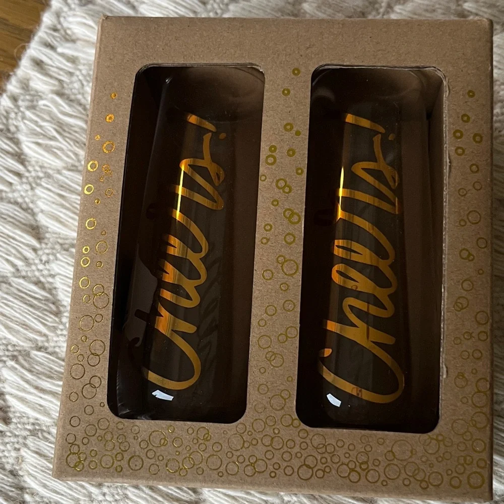 New in box Paper Source Stemless Champagne Glasses with Gold Cheers Text
